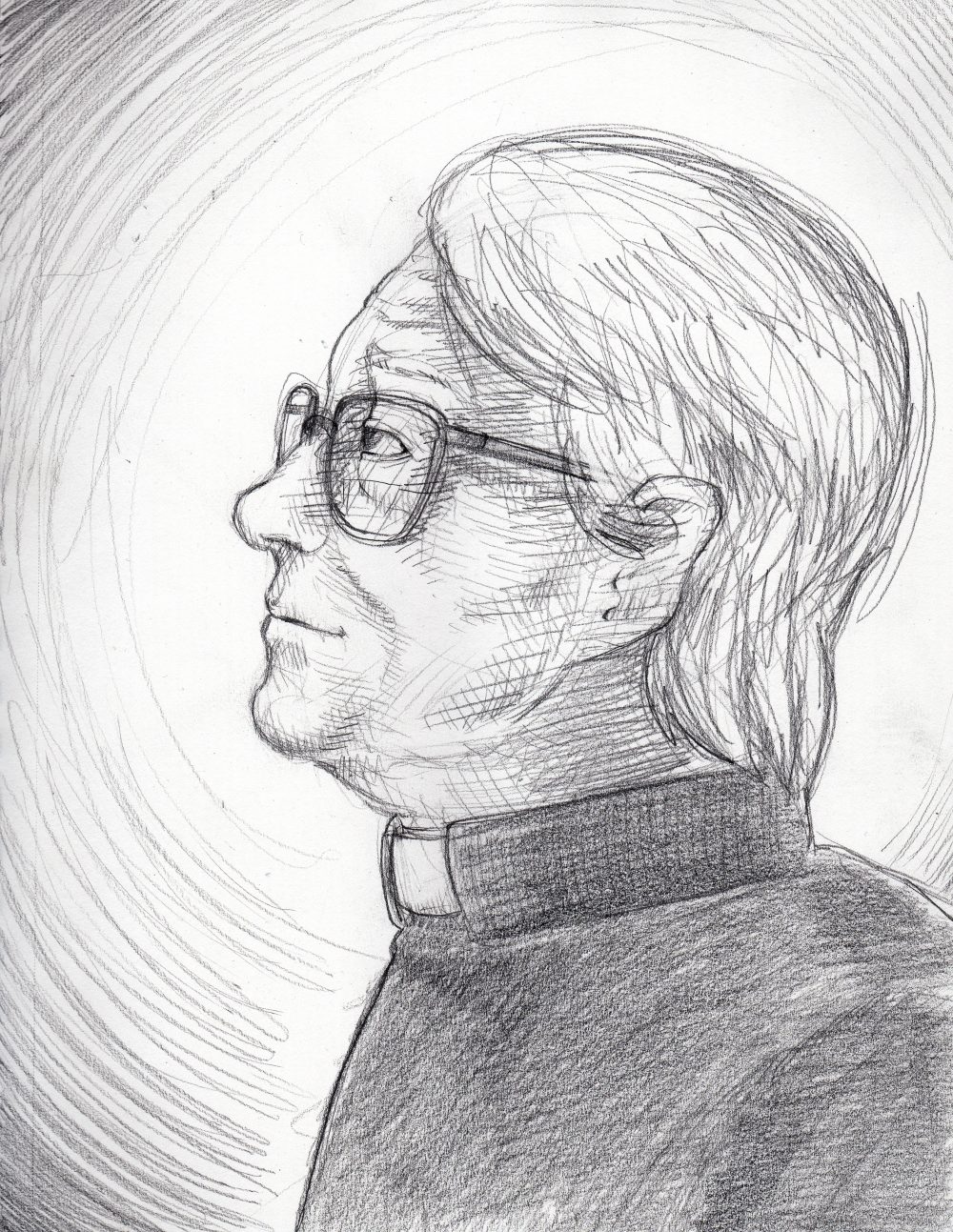 An image of Father Daniel Salat in left-facing profile, looking to picture-left. He is wearing a dark shirt with a priest's collar. He has mussed-up white hair, old-fashioned 1960s style glasses and is dressed as a priest. He has a rounded, wrinkled face and looks to be in his mid-to-late-70s in age. His expression is reverent.