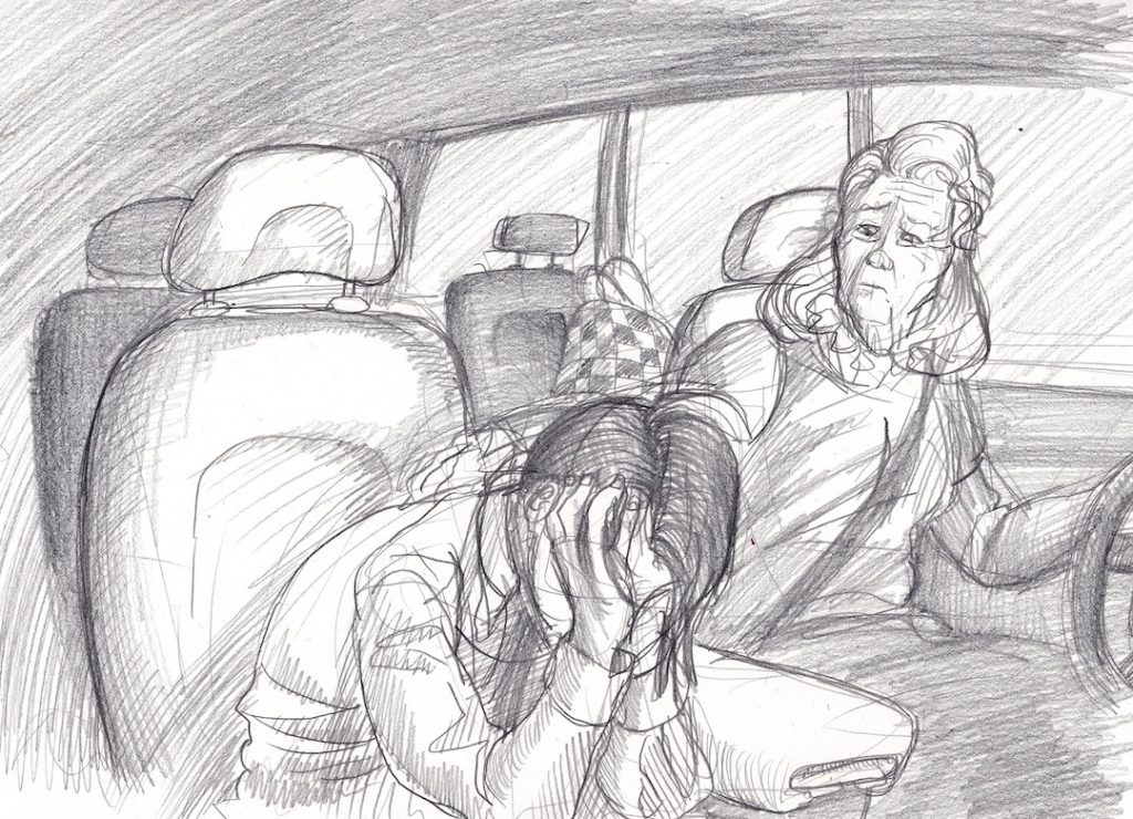 This is an interior view of the front and back seats of Hilda Leek's minivan. In the front passenger seat, which is to our foreground on the left, we see Rick Boyle looking despondent, with his head lowered and his face in his hands. His hair hangs loose over his fingers. To the right of the foreground, we see Hilda in the driver's seat. She is holding on to the steering wheel with her left hand and resting her right hand on Rick's left shoulder and back. She looks worried and concerned. In the background, in the seat behind Hilda, we see Hilda's red-and-black checkered bag. 